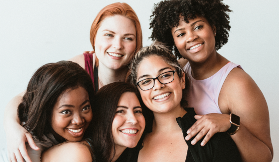 A diverse group of women standing together in solidarity